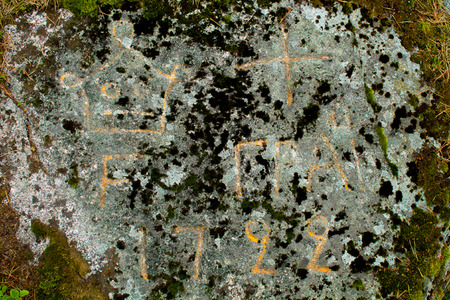 An old stone, a border marker between Finland and Russiaの写真素材