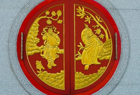 chinese temple window in Thailand,Kammalawat Dragon temple windowの写真素材