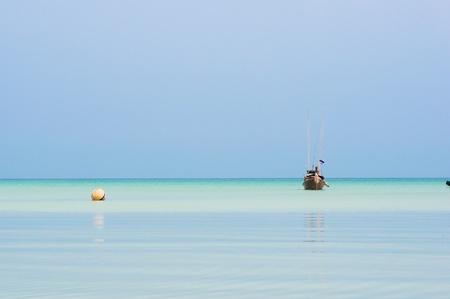a small fishing boat near Surin island ,Southern of Thailandの写真素材