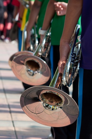 young musicians are playing on trumpets 
