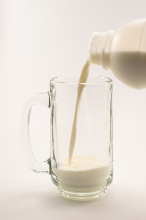 glass of milk on white backgroundの写真素材