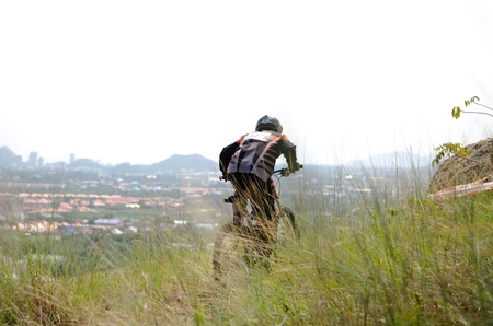 Hua Hin,Thailand - December 1st : Unidentified bicycle racing downhill competitors during the "Hua Hin mountain bike racing 2012  " at Hinlekfai mountain on December 1st, 2012 in Hua Hin,Thailand. のeditorial素材