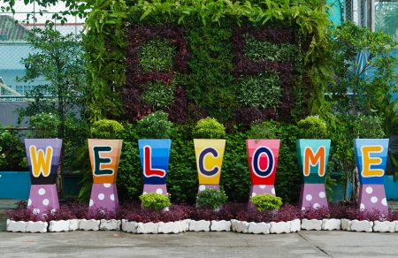welcome sign word on colorful flower potsの写真素材