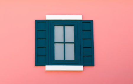 dark green vintage window on pink wallの写真素材