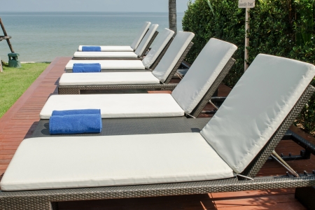 empty white sunbed with wrapped towelsの写真素材