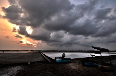 sunset at the salt farm in Petchaburi in Thailandの写真素材
