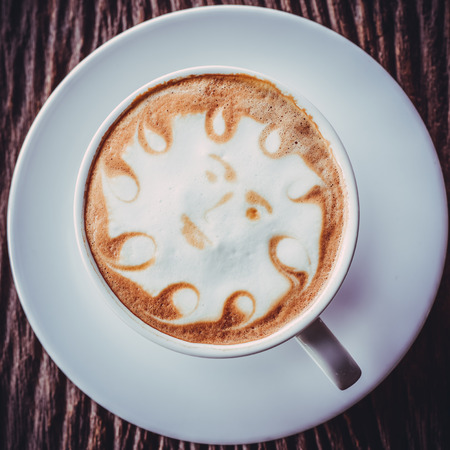 a cup of vintage coffee on the old wood backgroundの写真素材