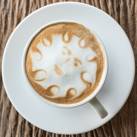 a cup of vintage coffee on the old wood backgroundの写真素材