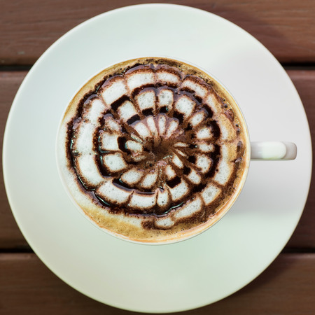 a cup of vintage coffee on the brown wood backgroundの写真素材