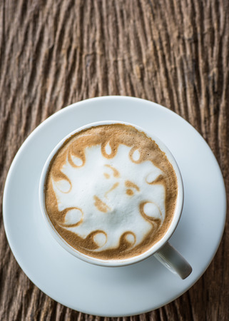 a cup of vintage coffee on the old wood backgroundの写真素材