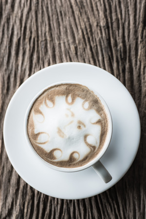 a cup of vintage coffee on the old wood backgroundの写真素材