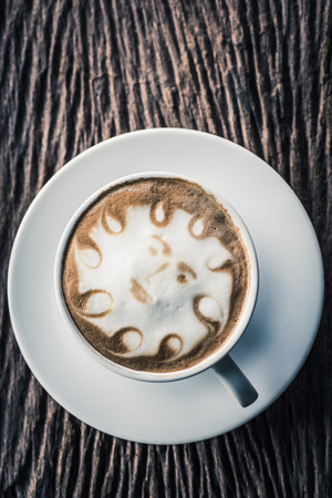 a cup of vintage coffee on the old wood backgroundの写真素材