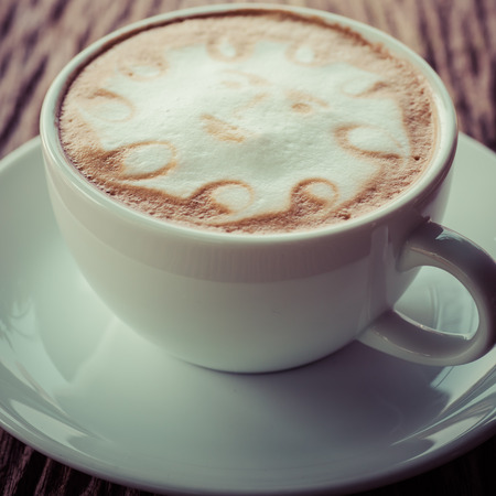 a cup of vintage coffee on the old wood backgroundの写真素材