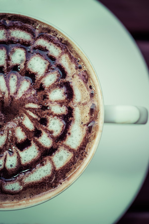 a cup of vintage coffee on the brown wood backgroundの写真素材