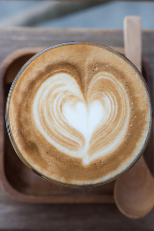 a cup of vintage coffee on the brown wood backgroundの写真素材