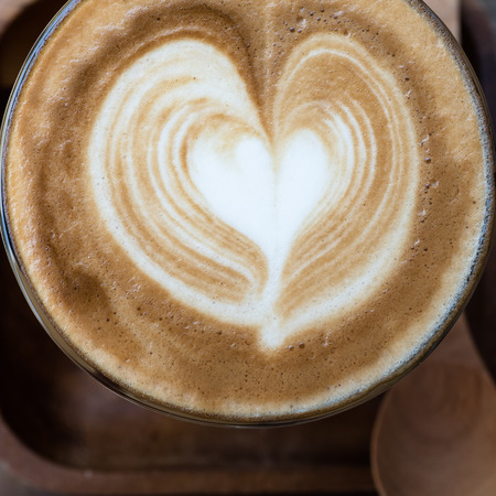 a cup of vintage coffee on the brown wood backgroundの写真素材