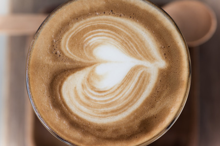 a cup of vintage coffee on the brown wood backgroundの写真素材