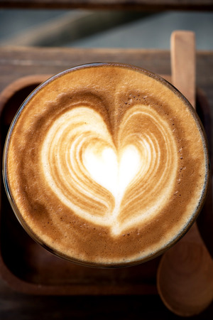 a cup of vintage coffee on the brown wood backgroundの写真素材