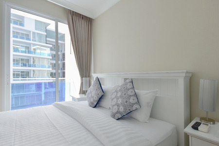 white pillows in white bedroomの写真素材