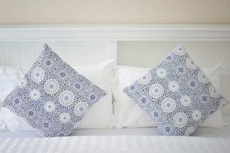 white pillows in white bedroomの写真素材