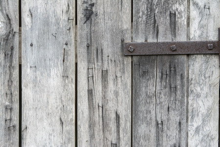 Wooden covered with nails and staplesの写真素材