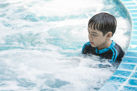 The Asian boy swimming on the weekendの写真素材