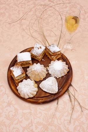 Fresh baked cookies on a wooden plateの写真素材