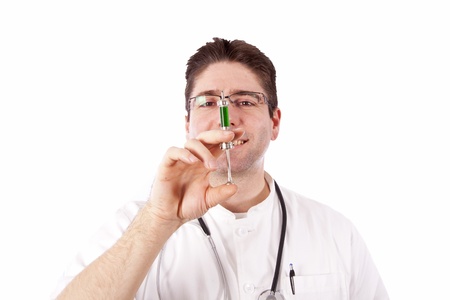 Doctor smiling and holding an injectionの写真素材