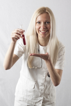 Pretty young female surgeon posing in uniformの写真素材
