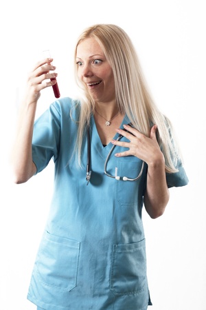 Pretty young female surgeon posing in uniformの写真素材