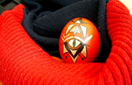 Beautiful painted easter egg on a colorful backgroundの写真素材