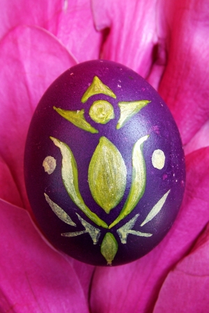 Beautiful painted easter egg on a colorful backgroundの写真素材