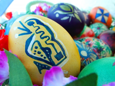 Beautiful painted easter eggs on a colorful backgroundの写真素材