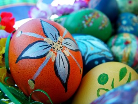 Beautiful painted easter eggs on a colorful backgroundの写真素材
