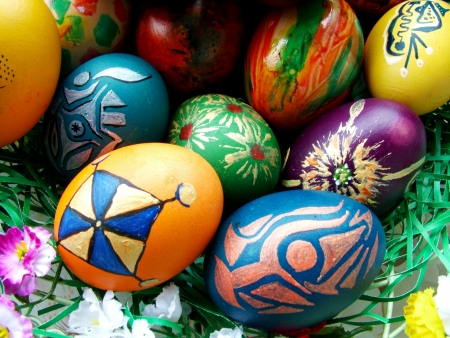Beautiful painted easter eggs on a colorful backgroundの写真素材