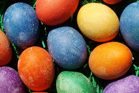Beautiful painted easter eggs on a colorful backgroundの写真素材
