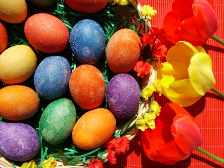 Beautiful painted easter eggs on a colorful backgroundの写真素材