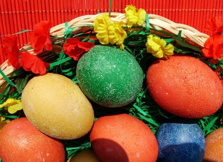 Beautiful painted easter eggs on a colorful backgroundの写真素材