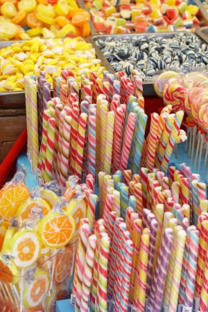 Many colorful Halloween sweets and candy filling backgroundの写真素材
