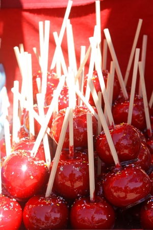 Delicious red candy apples with sprinklesの写真素材