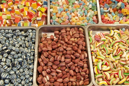 Many colorful Halloween sweets and candy filling backgroundの写真素材