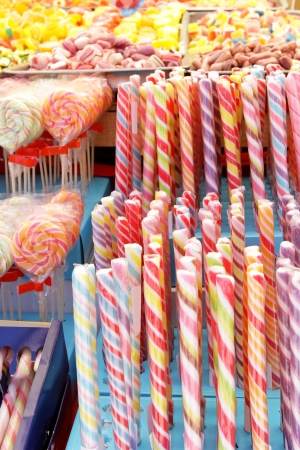 Many colorful Halloween sweets and candy filling backgroundの写真素材
