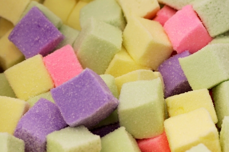 Many colorful Halloween sweets and candy filling backgroundの写真素材