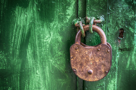 Old lock on a wooden doorの写真素材