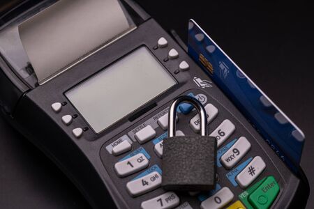 POS terminal, Payment Machine with credit card on black background. Contactless payment with NFC technology- Account on card (mine) closed over years ago!!!の写真素材