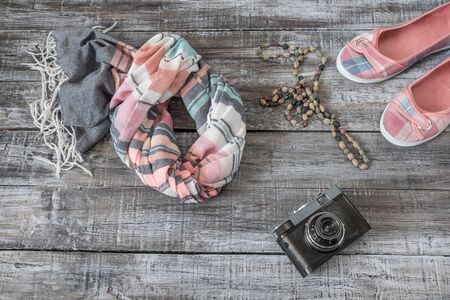 Vintage still life of random objects of modern woman on wooden boardの写真素材