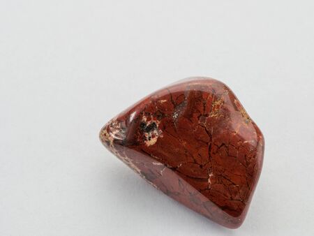 Jasper gemstone. isolated on white background. Macro shot.