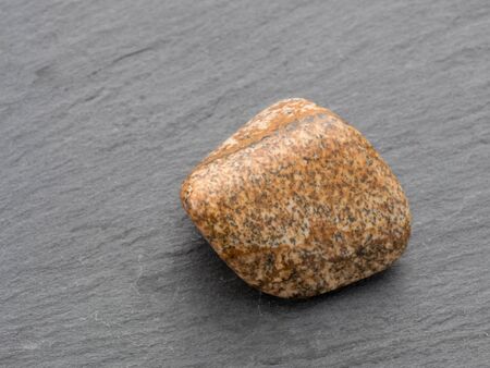 Jasper gemstone. isolated on black background. Macro shot