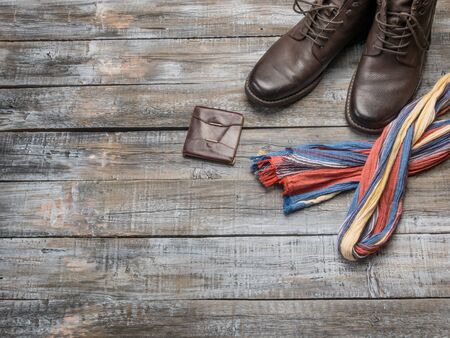 Accessories for travel top view on wooden background with copy space. Adventure and wanderlust concept image with travel accessories.の写真素材
