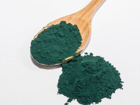 Spirulina Algae Powder, close upon white background .Macro, selective focusの写真素材